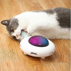 Cat playing with a colorful pet toy on a wooden floor