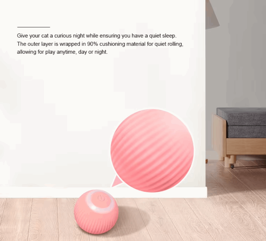 Pink cushioned ball on a wooden floor with text about cat comfort and quiet sleep.