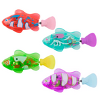 Four colorful toy fish on a white background