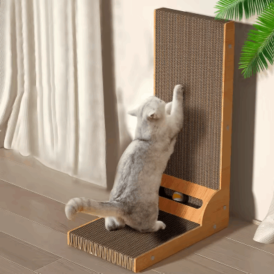 Cat using a wooden scratching post against a neutral background