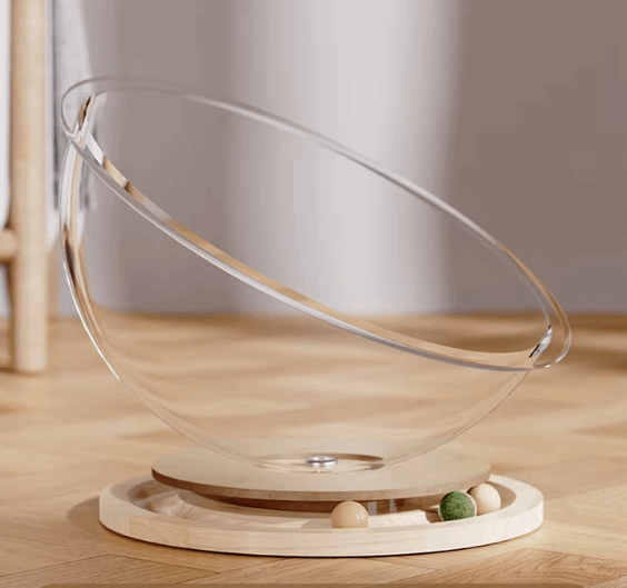 Glass bowl with wooden base on a wooden surface