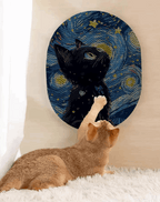 Cat playing with a round, textured toy resembling a famous artwork.